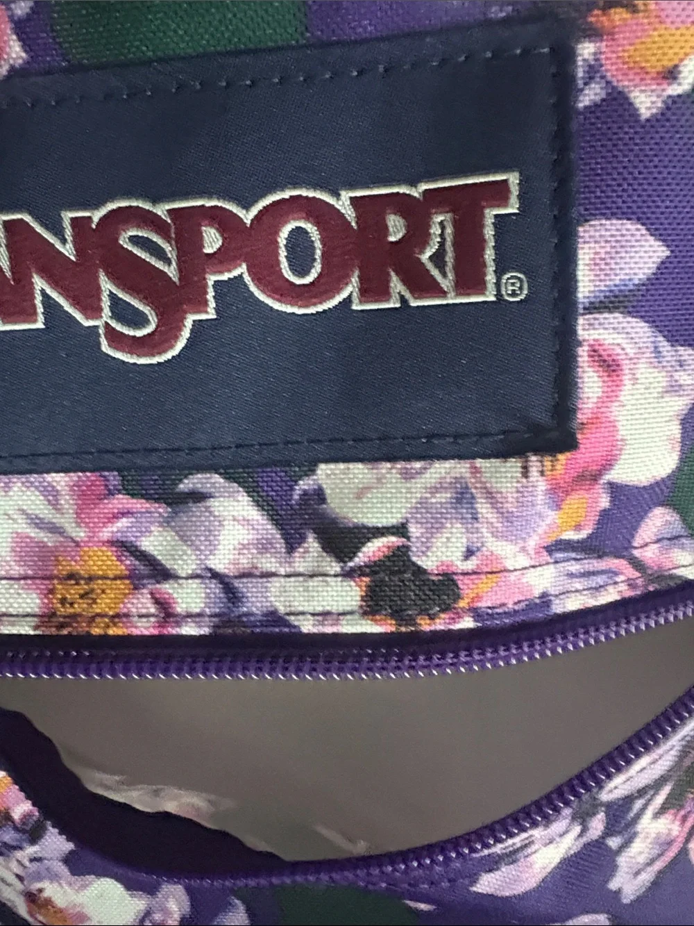Jansport Purple Floral Backpack with Green Accents and Brown Base